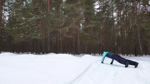 The athlete trains in the winter in the forest. Stock Footage 102404231