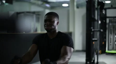 Athlete Uses Cable Machine at Gym Stock Footage 61413969
