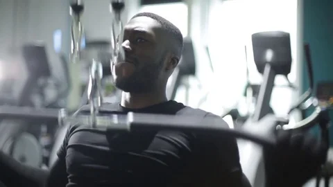 Athlete Uses Pull Down Machine at Gym Stock Footage 72551668