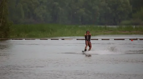 Athlete wakeboarder jumping on trampolines Stock Footage 64363471