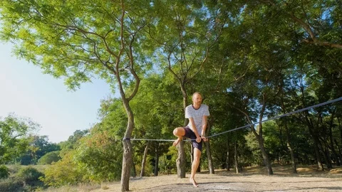 Athlete walking in slackline Stock Footage 121287097