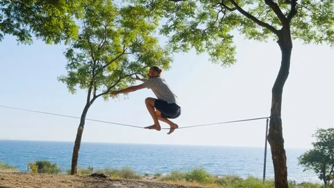 Athlete walking in slackline Stock Footage 121287184