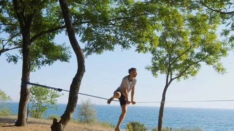 Athlete walking in slackline Stock Footage 121287418