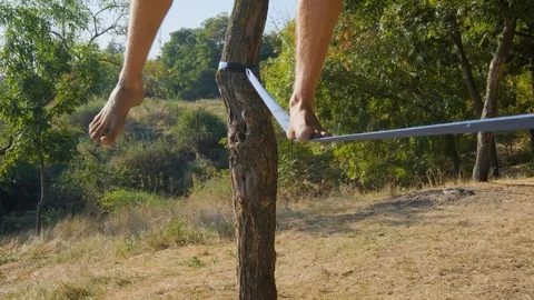Athlete walking in slackline Stock Footage 121287882