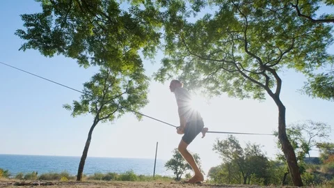 Athlete walking in slackline Stock Footage 121287917