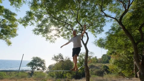 Athlete walking in slackline Stock Footage 121288188