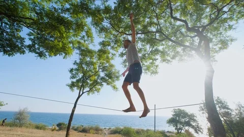 Athlete walking in slackline Stock Footage 121288270