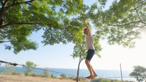 Athlete walking in slackline Stock Footage 121288374