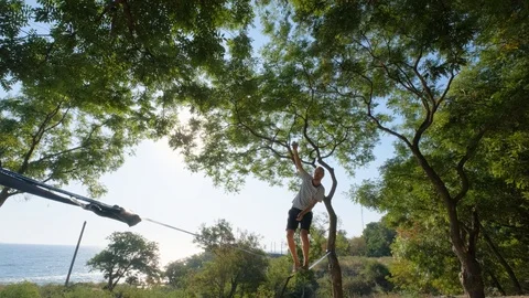 Athlete walking in slackline Stock Footage 121288385
