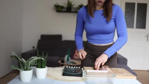 Athlete weighs chicken for precise calorie intake. Stock Footage 339856507
