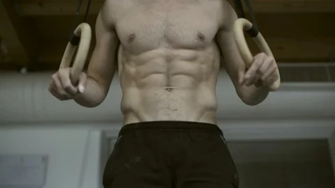 Athlete working out with gymnastic rings Stock Footage 127438448