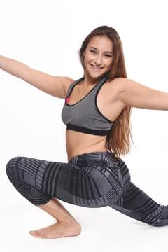 Athlete young woman doing exercise. Stock Photos
