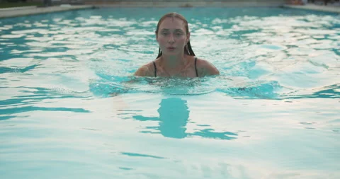 Athlete young woman swims in swimming po... | Stock Video | Pond5