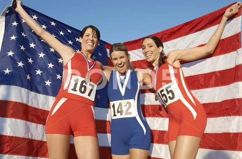 Athletes Celebrating With Medals And American Flag Stock-Fotos