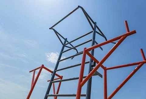 Athletes engage in workouts using parallel bars at a gym in a spacious outd.. Stock Photos