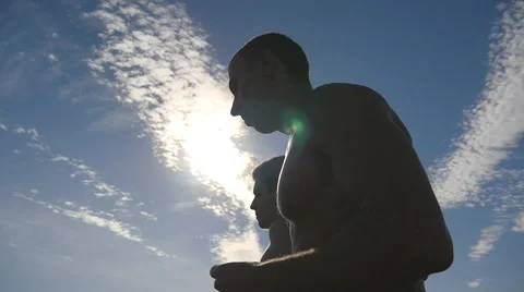 Athletes exercising and running against blue sky. Slowmotion Stock Footage