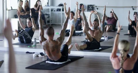 Athletes exercising together in group class Stock Footage 100185567