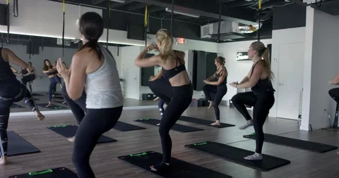 Athletes exercising together in a gym class Stock Footage 100188480