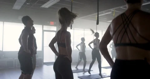 Athletes exercising together in a gym class Stock Footage 100188501
