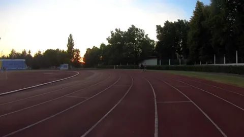 Athletes jogging, training at the stadium Stock Footage 169406083