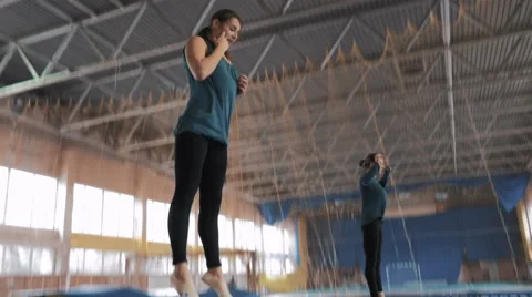 Athletes jumping on the trampoline, 4k Stock Footage 60543807