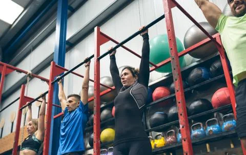 Athletes ready to do pull ups in the box Stock Photos