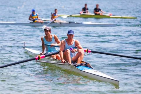 Athletes on a rowing competition Stock Photos
