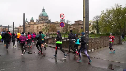 Athletes running a morathon on a rainy day in Leipzig, Germany Stock Footage 205002020