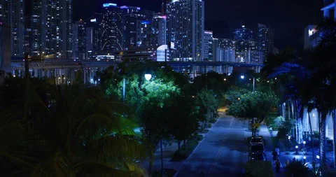 Athletes running through an empty street against a cityscape Stock Footage 104227158