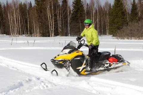 Athletes on a snowmobile. Stock Photos