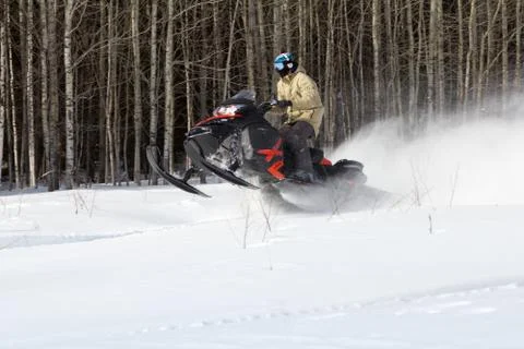 Athletes on a snowmobile. Stock Photos