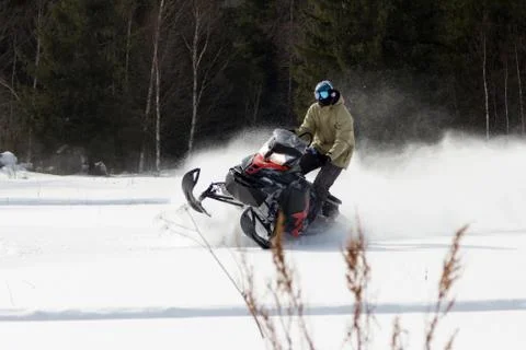 Athletes on a snowmobile. Stock Photos
