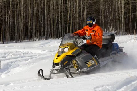 Athletes on a snowmobile. Stock Photos