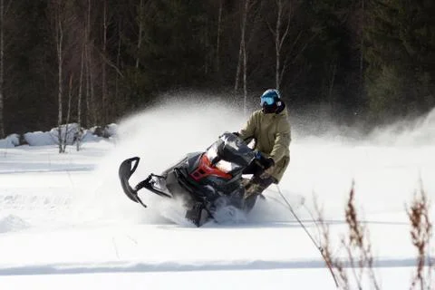 Athletes on a snowmobile. Stock Photos