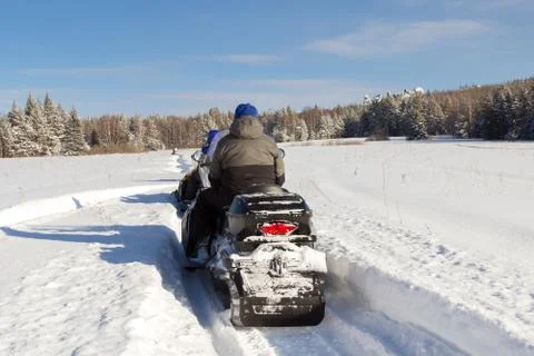 Athletes on a snowmobile. Stock Photos