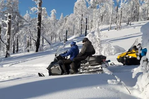 Athletes on a snowmobile Stock Photos