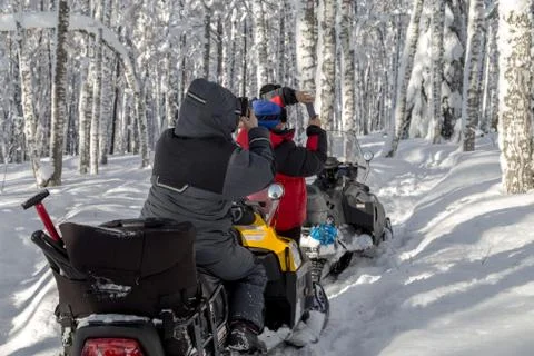 Athletes on a snowmobile Stock Photos