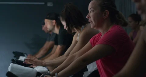 Athletes in a spin class Stock Footage 97471069