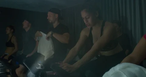 Athletes in a spinning class Stock Footage 97404976