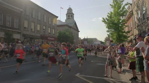 Athletes take off from the start line at the 2016 Perth Kilt Run Stock Footage 64738975