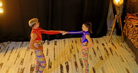 Athletes train the dance program, do acrobatic elements. Athletes do a stoke on Stock Footage 126216080