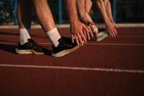 Athletes warming up at the stadium Fotos de archivo