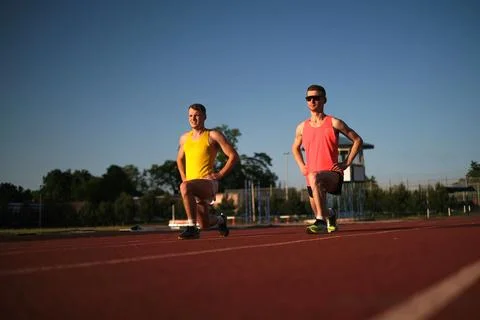 Athletes warming up at the stadium Fotos de archivo