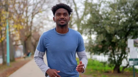 Athletic african american man jogging in parisian park Stock Footage 327456827