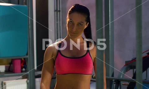 Athletic attractive woman in the gym. Bodybuilding concept. Stock Photos