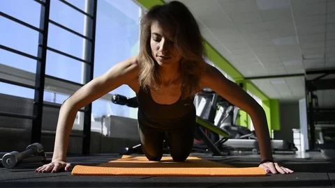 Athletic Beautiful Woman Does Push-ups as Part Stock Footage 87654701