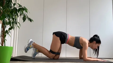 Athletic Beautiful Woman Does Workout. Brunette Woman In Grey Stock Footage 127225451
