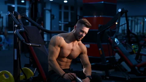 Athletic body. Shirtless model guy is posing to the camera. Strong muscular man Stock Footage 146600077