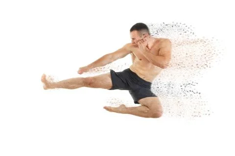 Athletic boxer fighter performing a flying side kick Stock Photos
