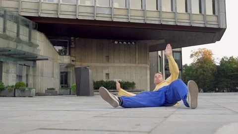 Athletic Breakdancer Moves Across Concrete Area Stock Footage 87709732
